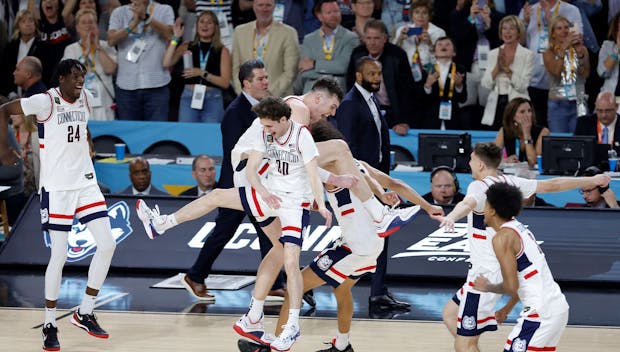 GLENDALE, ARIZONA - APRIL 08: The Connecticut Huskies celebrate after beating the Purdue Boilermakers 75-60 to win the NCAA Men's Basketball Tournament National Championship game at State Farm Stadium on April 08, 2024 in Glendale, Arizona. (Photo by Chris Coduto/Getty Images)