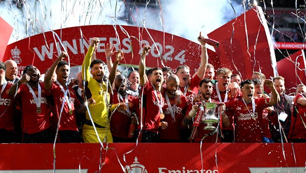 LONDON, ENGLAND - MAY 25: Bruno Fernandes of Manchester United lifts the Emirates FA Cup Trophy after his team's victory in the Emirates FA Cup Final match between Manchester City and Manchester United at Wembley Stadium on May 25, 2024 in London, England. (Photo by Mike Hewitt/Getty Images)